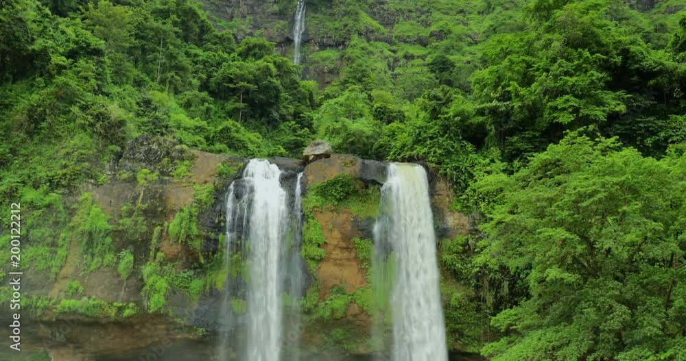 Beautiful landscape of Sodong waterfall with green trees at Ciletuh Geopark, Sukabumi, West Java, Indonesia. Shot in 4k resolution Beautiful landscape of Sodong waterfall with green trees at Ciletuh Geopark, Sukabumi, West Java, Indonesia. Shot in 4k resolution