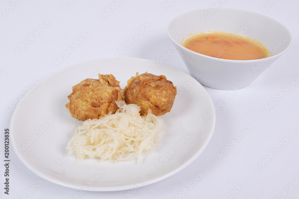 Millets potatoes dumplings with tempeh on a white Millets potatoes dumplings with tempeh on a white