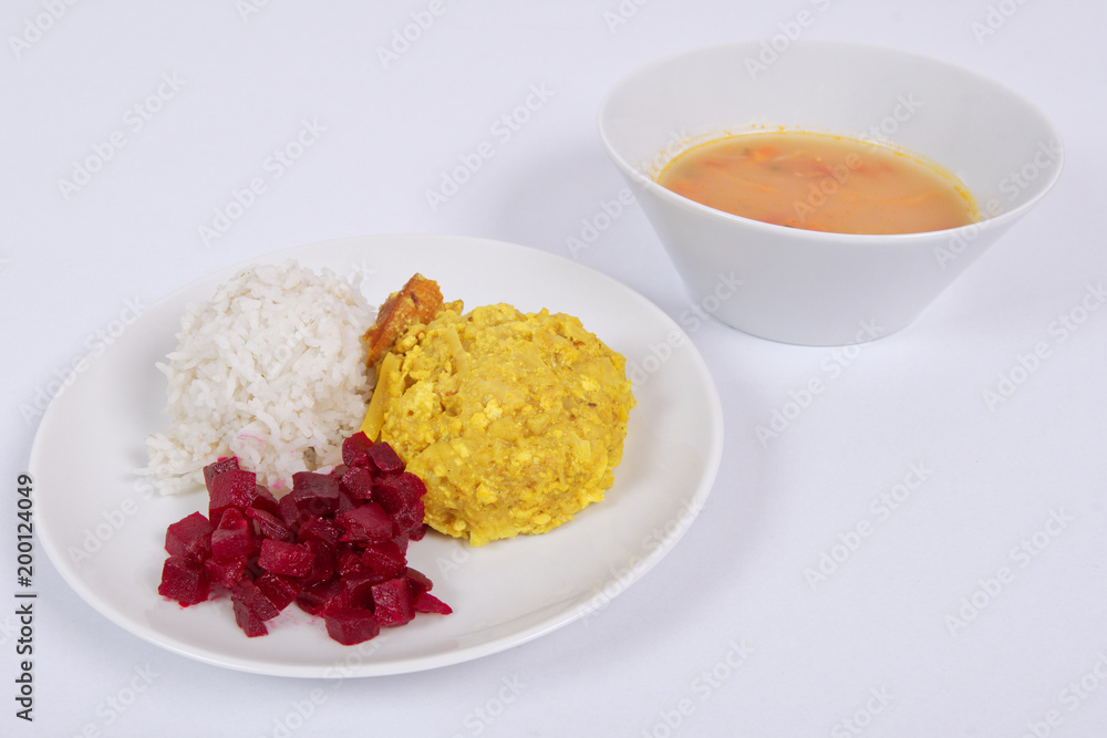 Cauliflower with turmeric and rice on a white Cauliflower with turmeric and rice on a white