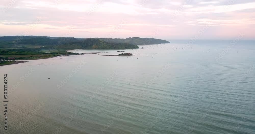 Beautiful aerial view of Palangpang beach on misty morning at Ciletuh Geopark, Sukabumi, West Java, Indonesia. Shot in 4k resolution Beautiful aerial view of Palangpang beach on misty morning at Ciletuh Geopark, Sukabumi, West Java, Indonesia. Shot in 4k resolution
