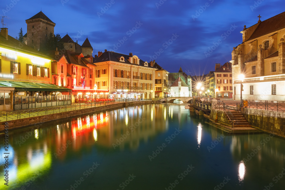 Thiou river during morning blue hour in old city of Annecy, Venice of the Alps, France
