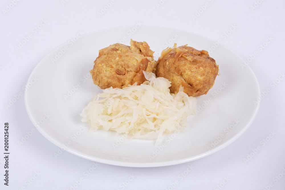 Millets potatoes dumplings with tempeh on a white Millets potatoes dumplings with tempeh on a white