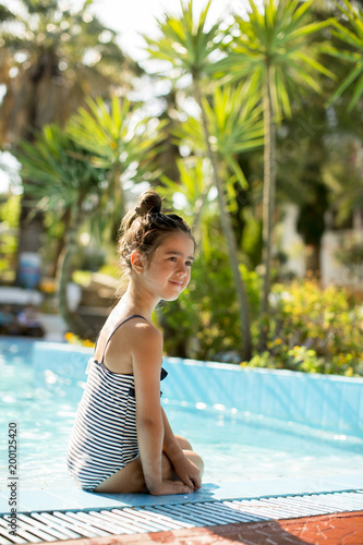 Cute little girl on the poolside