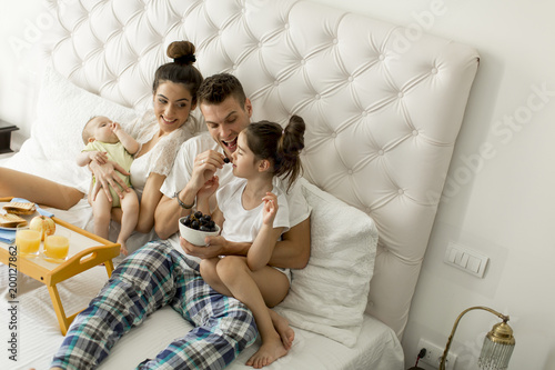 Young familly on the bed