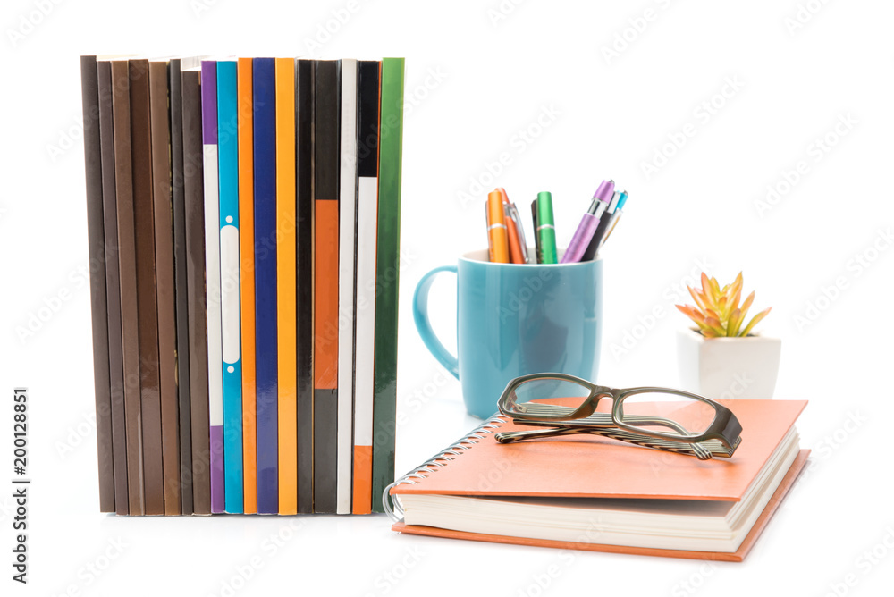 Mockup of Business or education workspace concept : books , eyeglasses , colorful pen in blue mug and small yellow tree in white pot isolated on white background Mockup of Business or education workspace concept : books , eyeglasses , colorful pen in blue mug and small yellow tree in white pot isolated on white background