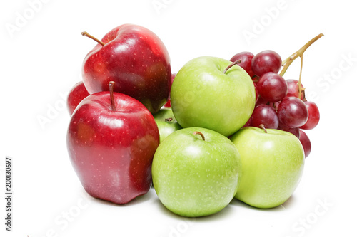 Heap of different fruits apple and grape isolated on white background