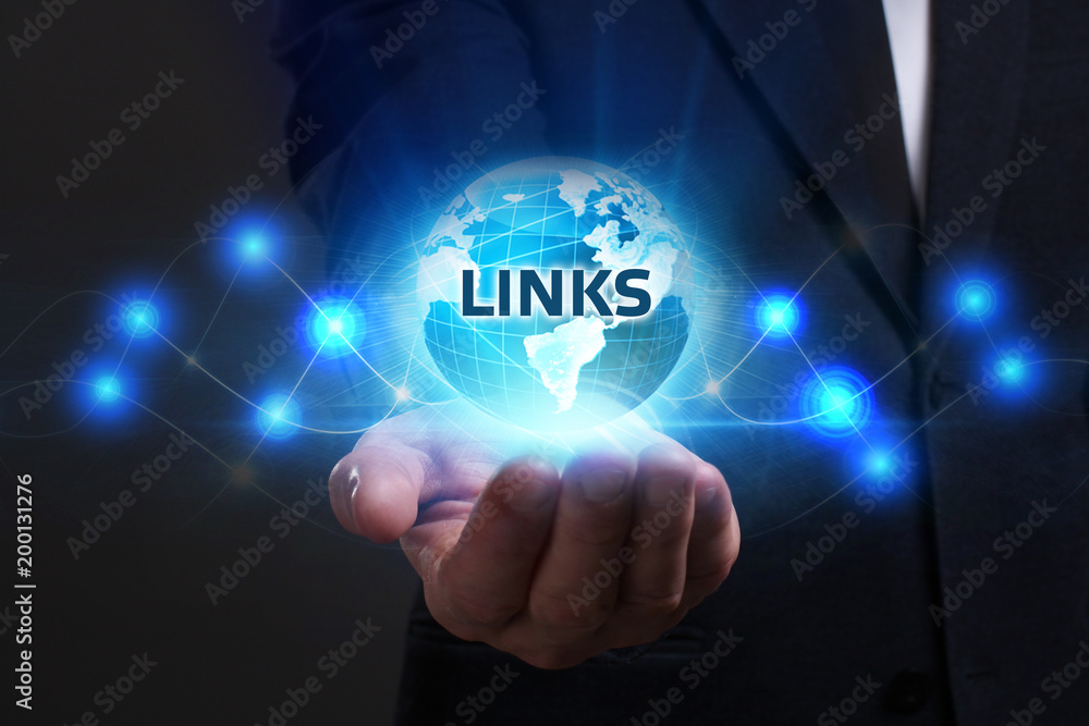 Business, Technology, Internet and network concept. Young businessman working on a virtual screen of the future and sees the inscription: Links Business, Technology, Internet and network concept. Young businessman working on a virtual screen of the future and sees the inscription: Links