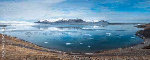 Panorama view of Jokulsarlon Glacier lagoon at daylight and blue sky with mountains in Iceland
