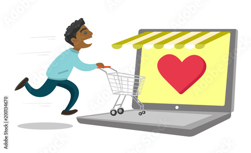 Young african-american man using laptop for online shopping