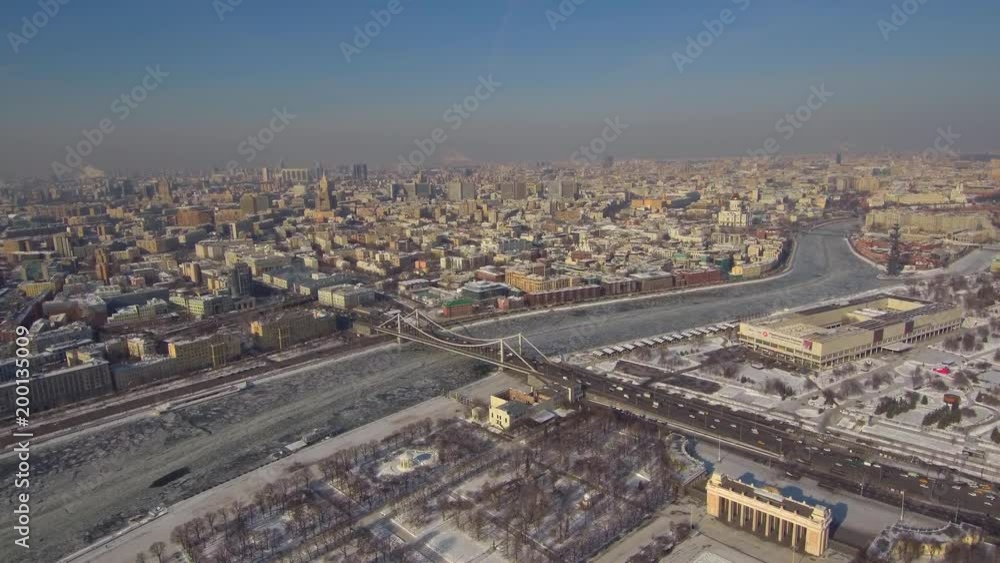 Aerial fly over view of Moscow city center with Gorky park and river in sunny day Aerial fly over view of Moscow city center with Gorky park and river in sunny day
