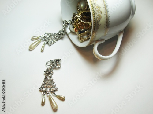 vintage jewelry and a tea cup
