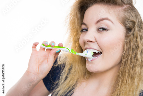 Woman brushing cleaning teeth