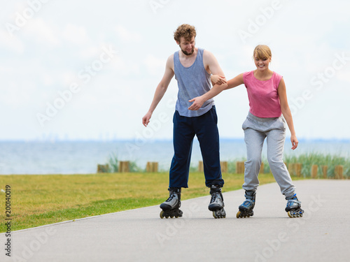 roller skater couple skating outdoor