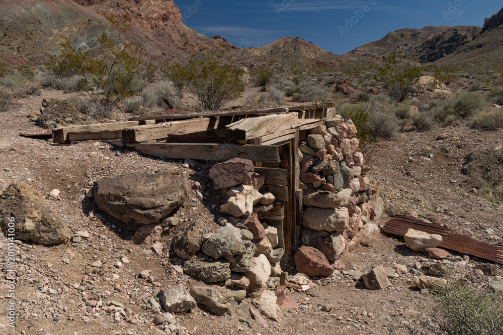 Old abandoned mining entrance in Titus Canyon, Grapevine Mountains, Mojave Desert, Death Valley National Park Old abandoned mining entrance in Titus Canyon, Grapevine Mountains, Mojave Desert, Death Valley National Park