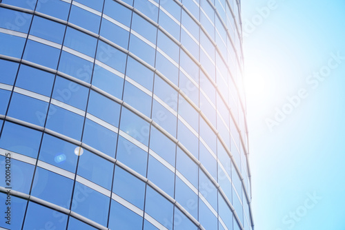 low angle view of modern curved blue glass building