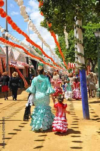 Mother with little daughter at the April Fair, Seville Fair, women from Spain © joserpizarro