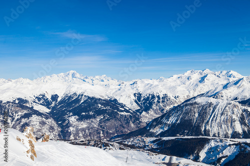 Spectacular snowy mountain panorama in cold winter. Famous ski resort in French Alps - Courchevel 1850, France. © umike_foto