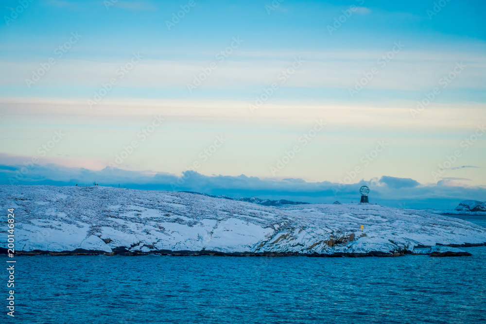 Gorgeous landscape of coastal scenes ofcoast covered with snow on Hurtigruten during voyage in a good weather