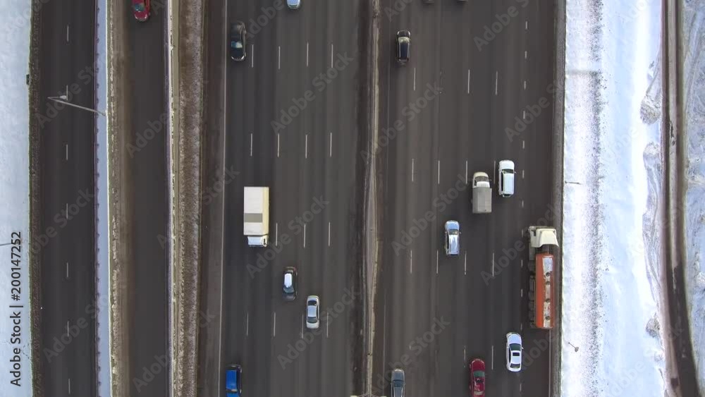 Aerial fly over view of city highway in sunny winter day Aerial fly over view of city highway in sunny winter day