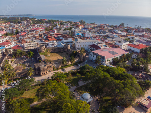 AERIAL view of the Stone Town, old part of Zanzibar City. Flight above main city of Zanzibar, Tanzania, Africa, Indian Ocean