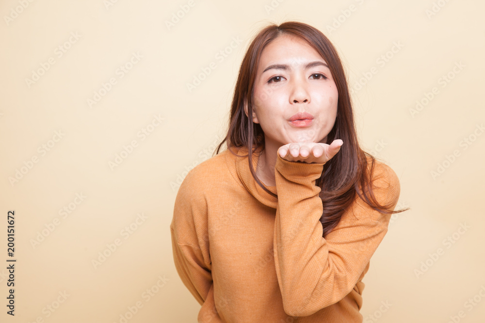 Beautiful young Asian woman blow a kiss. Beautiful young Asian woman blow a kiss.