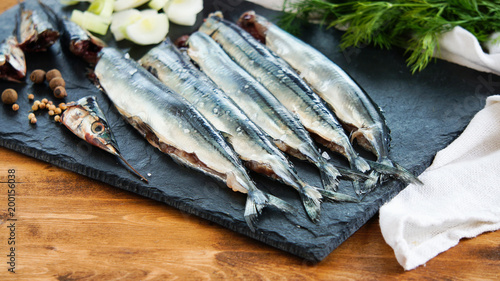 raw fresh needlefish (belonidae family) on the plate ready to cook photo