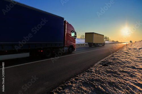 Truck transportation on the road at sunset