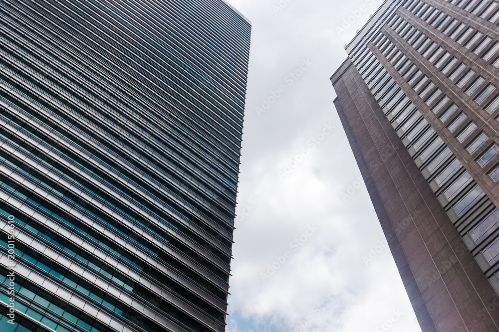 Panoramic and perspective angle view to steel background of glass high rise building skyscraper, commercial modern city of future. Business concept of successful industrial architecture Panoramic and perspective angle view to steel background of glass high rise building skyscraper, commercial modern city of future. Business concept of successful industrial architecture