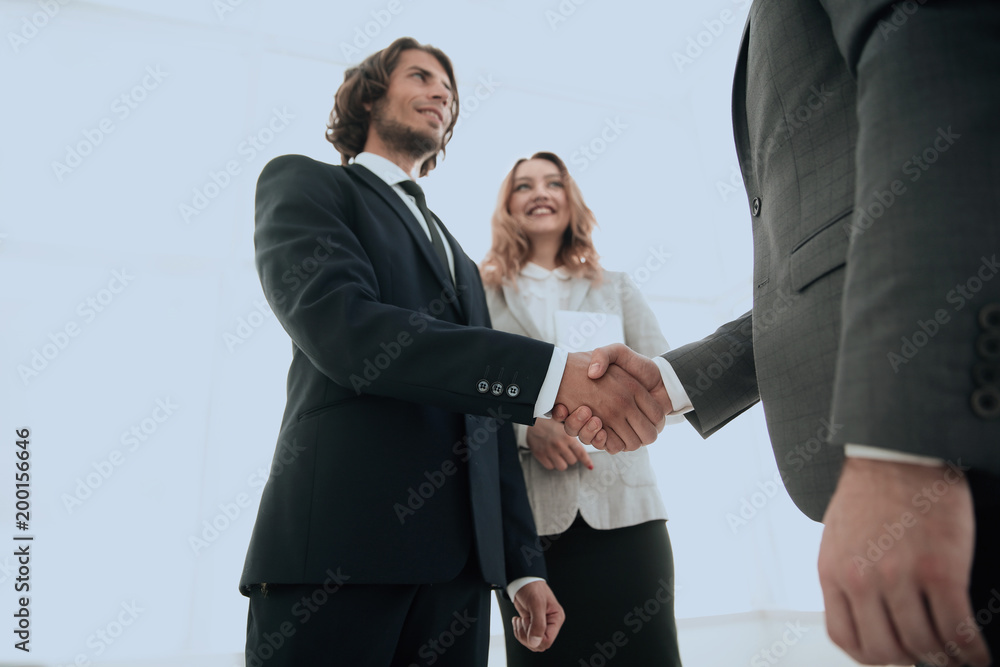 Photo of handshake of two happy businessmen Photo of handshake of two happy businessmen