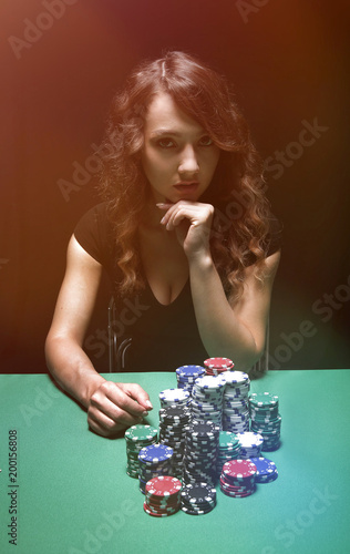 Attractive brunette playing poker