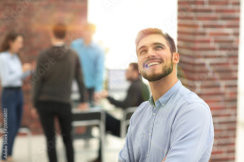 Cheerful man smiling  in office.