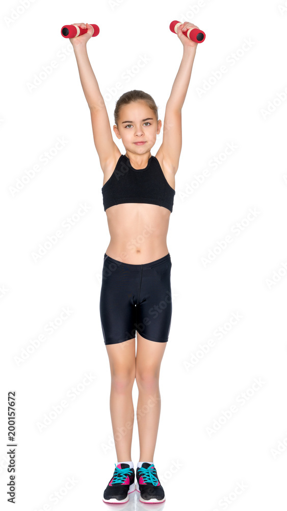 Little girl doing exercises with dumbbells. Little girl doing exercises with dumbbells.