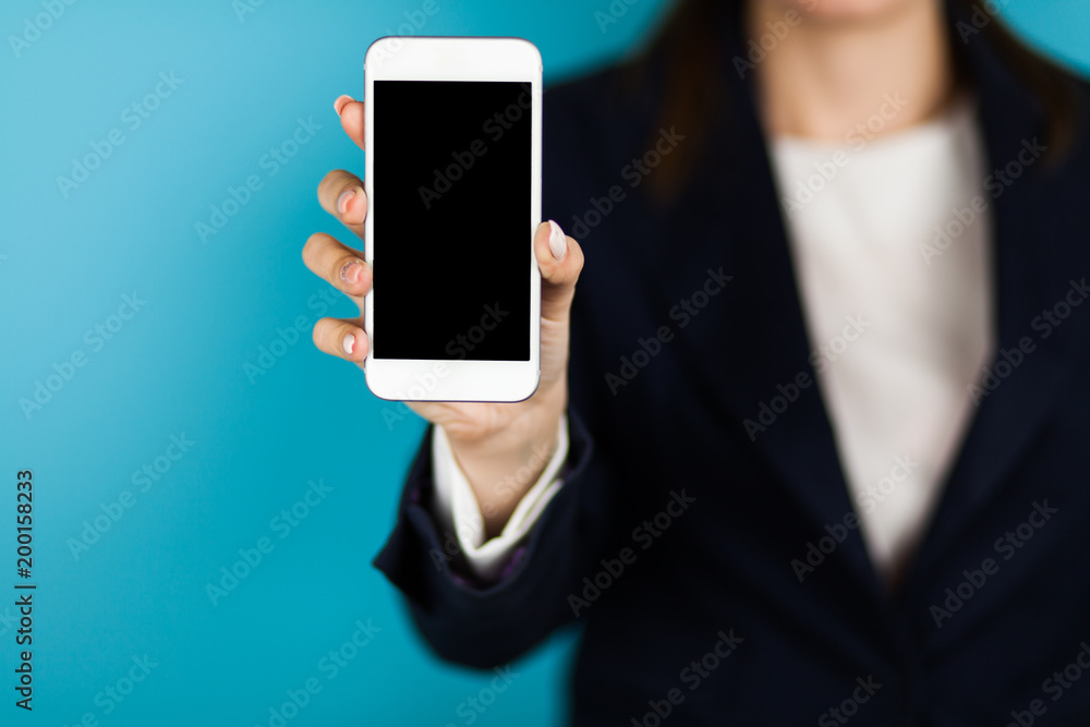 Female hand holding a phone Female hand holding a phone