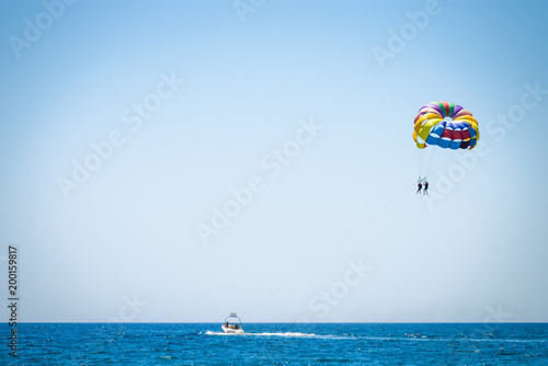 Parasailing on sea. Parasailing is a popular pastime in many resorts around the world.