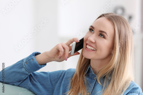 Beautiful woman talking on ...