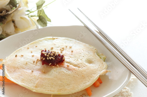 Korean food, vegetable pan cake with chilli pepper sauce photo