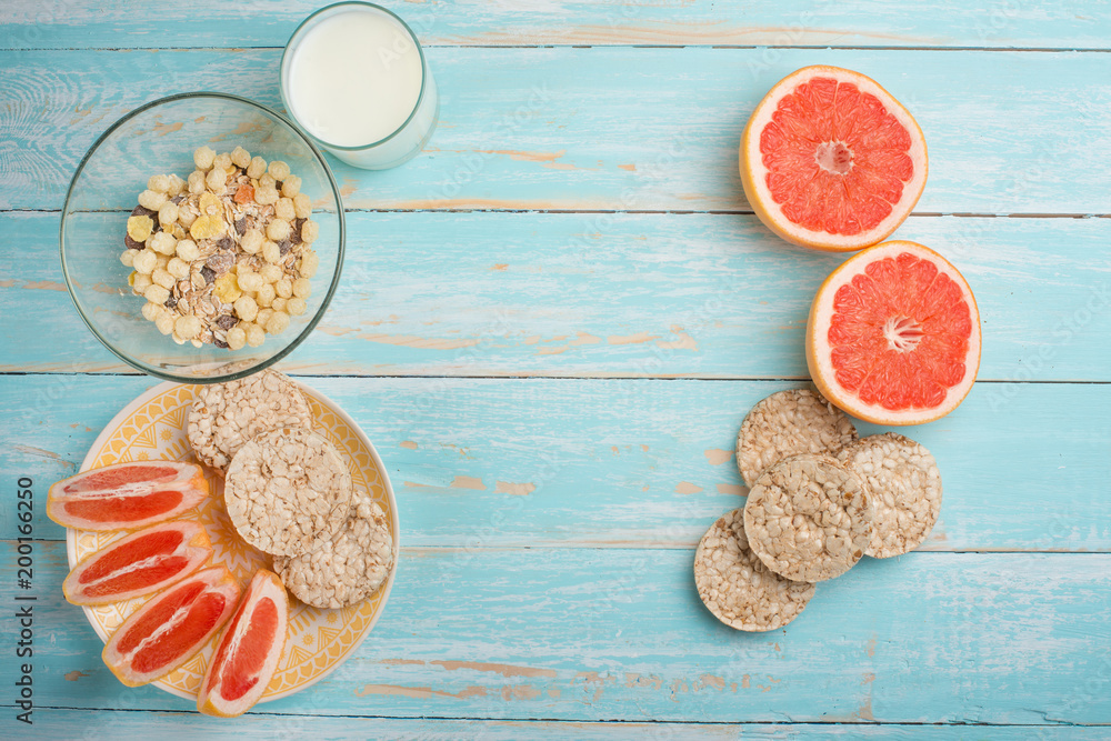 Grapefruit, muesli and bread. View from above, with an empty place for the inscription. The concept of a diet