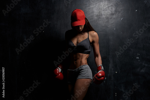 Beautiful young sporty girl in studio