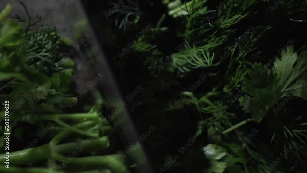 The knife chop the greens to pieces. The knife chop the greens to pieces.