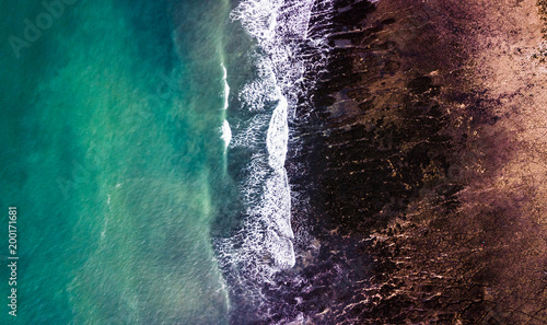 Drone view of a rocky beach in low tide