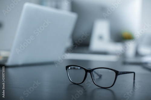 Glasses on table in office