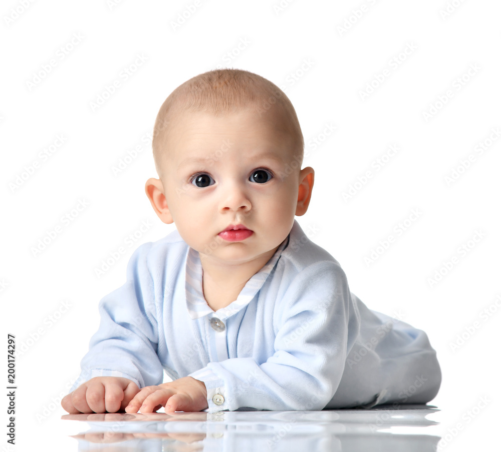 Four month Infant child baby boy in blue cloth lying happy looking at the camera isolated Four month Infant child baby boy in blue cloth lying happy looking at the camera isolated
