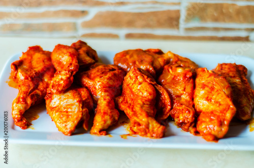 chicken wings marinated in a barbecue sauce, a typical American snack photo