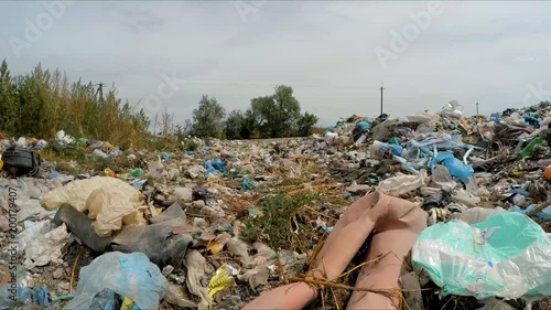 the camera is moving through a dump. Slow motion.