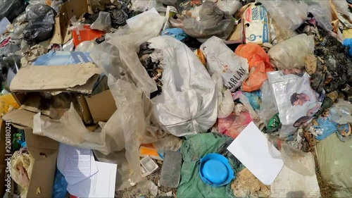 the camera is moving over the dump. Slow motion.