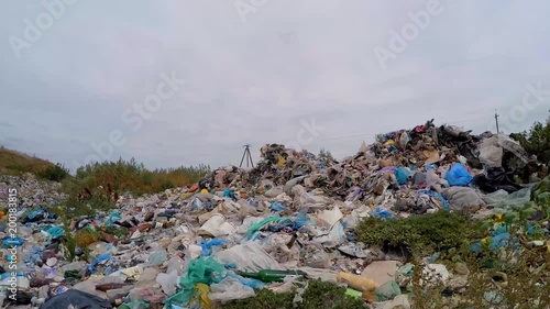 on the ground scattered piles of garbage. Slow motion.