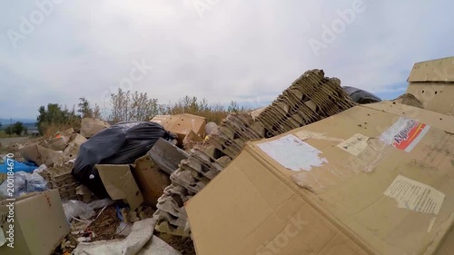 cardboard boxes lie next to the road. Slow motion.