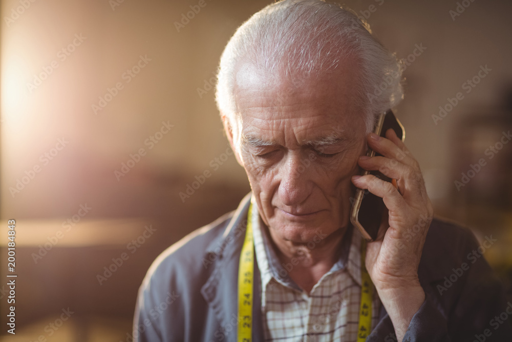 Close up of senior man talking on smartphone Close up of senior man talking on smartphone