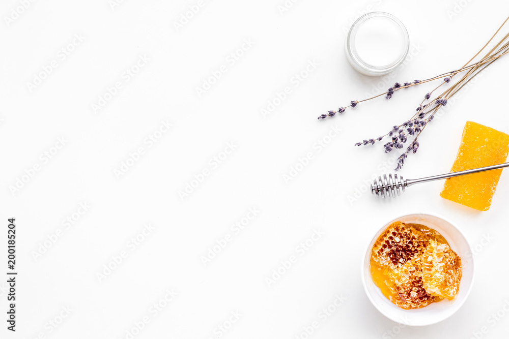 Fototapeta premium Aromatic theraphy and delicate skin care. Spa set based on honey on white background top view copy space