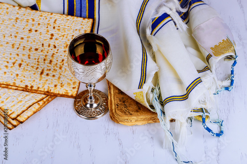 Canvas Print Red kosher wine with a white plate of matzah or matza and a Passover
